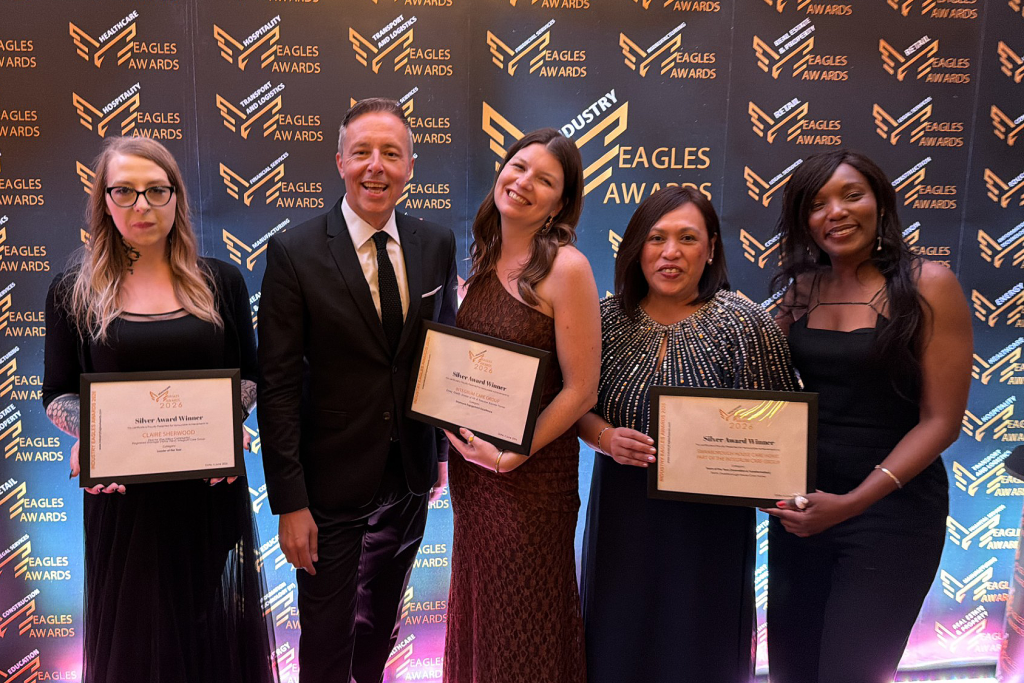 Group holding awards at event